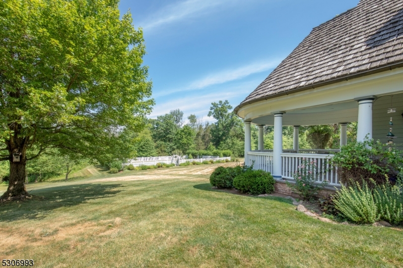 455 Long Lane Bedminster, NJ 07931 - Photo 41 of 46 a front view of a house with garden