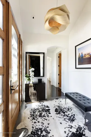 a very nice looking living room with a large window