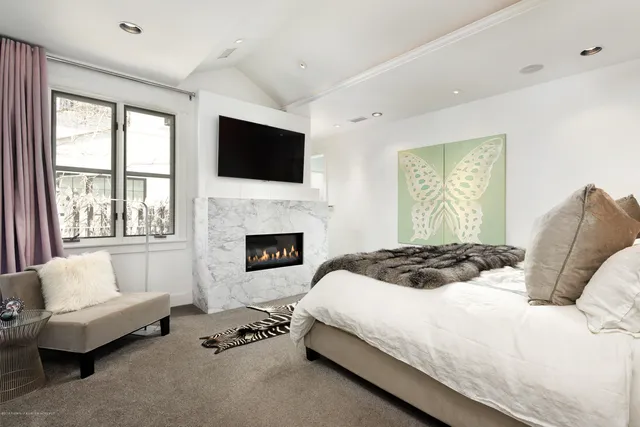 a bedroom with a bed and a couch