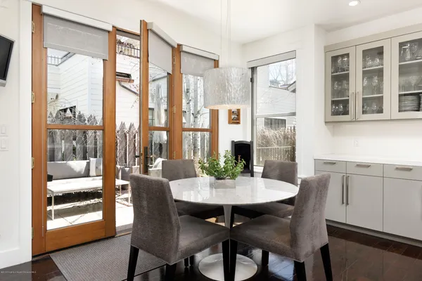 a view of a dining room with furniture window and outside view