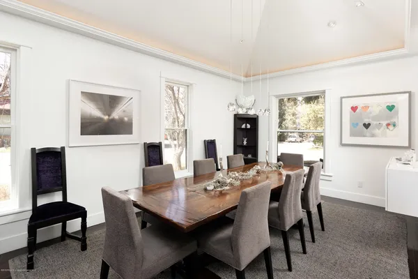 a view of a dining room with furniture and window