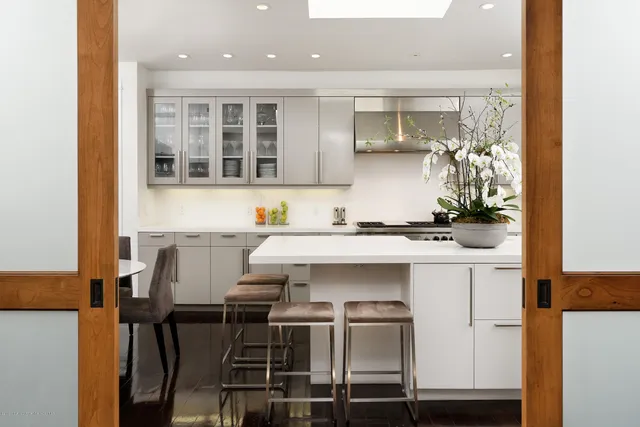 a kitchen with a sink cabinets and window