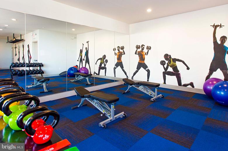 2121-41 Market Street, Unit 416 Philadelphia, PA 19103 - Photo 18 of 24 a view of a room with gym equipment