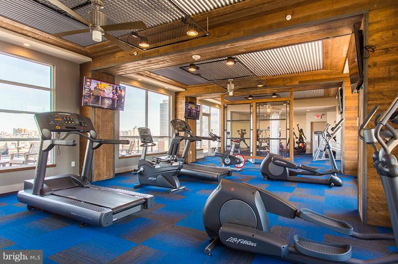 2121-41 Market Street, Unit 416 Philadelphia, PA 19103 - Photo 20 of 24 a view of a room with gym equipment
