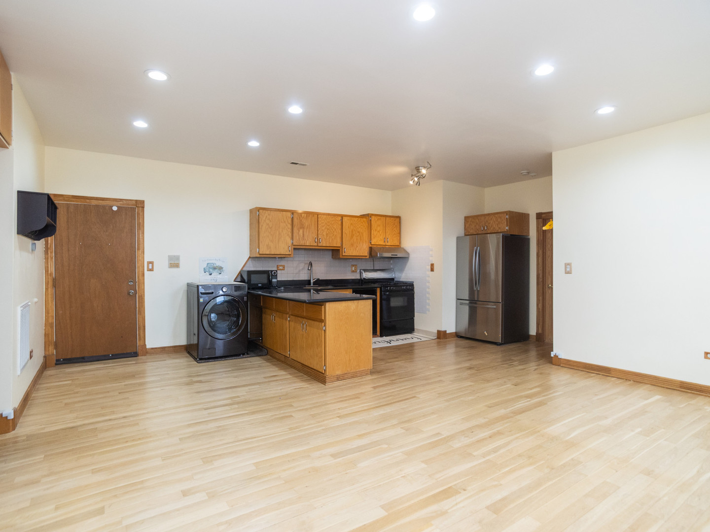 1758 West 35th Street, Unit 3R Chicago, IL 60609 - Photo 5 of 13 a large kitchen with stainless steel appliances a refrigerator and a stove top oven