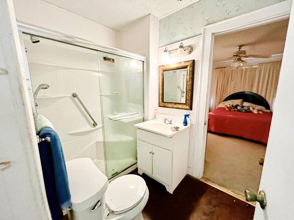 500 Chestnut Trail Forney, TX 75126 - Photo 11 of 19 a bathroom with a sink a toilet and shower