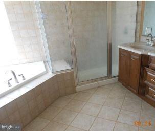 2121 Middleborough Road Baltimore, MD 21221 - Photo 9 of 10 a bathroom with a sink and a mirror