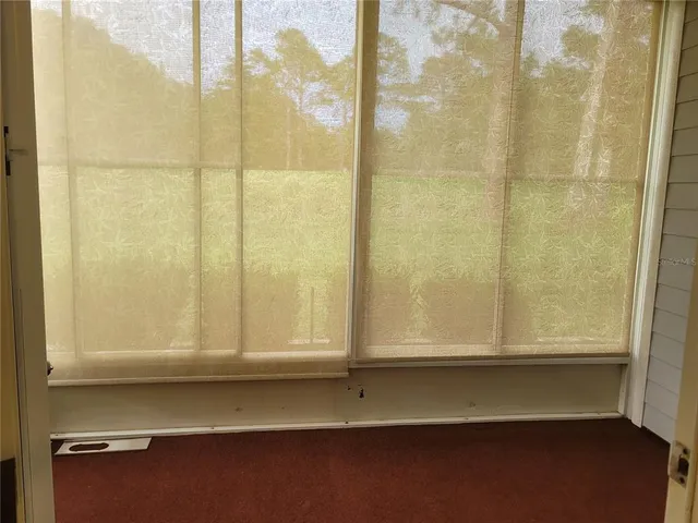 a view of wooden floor and a window
