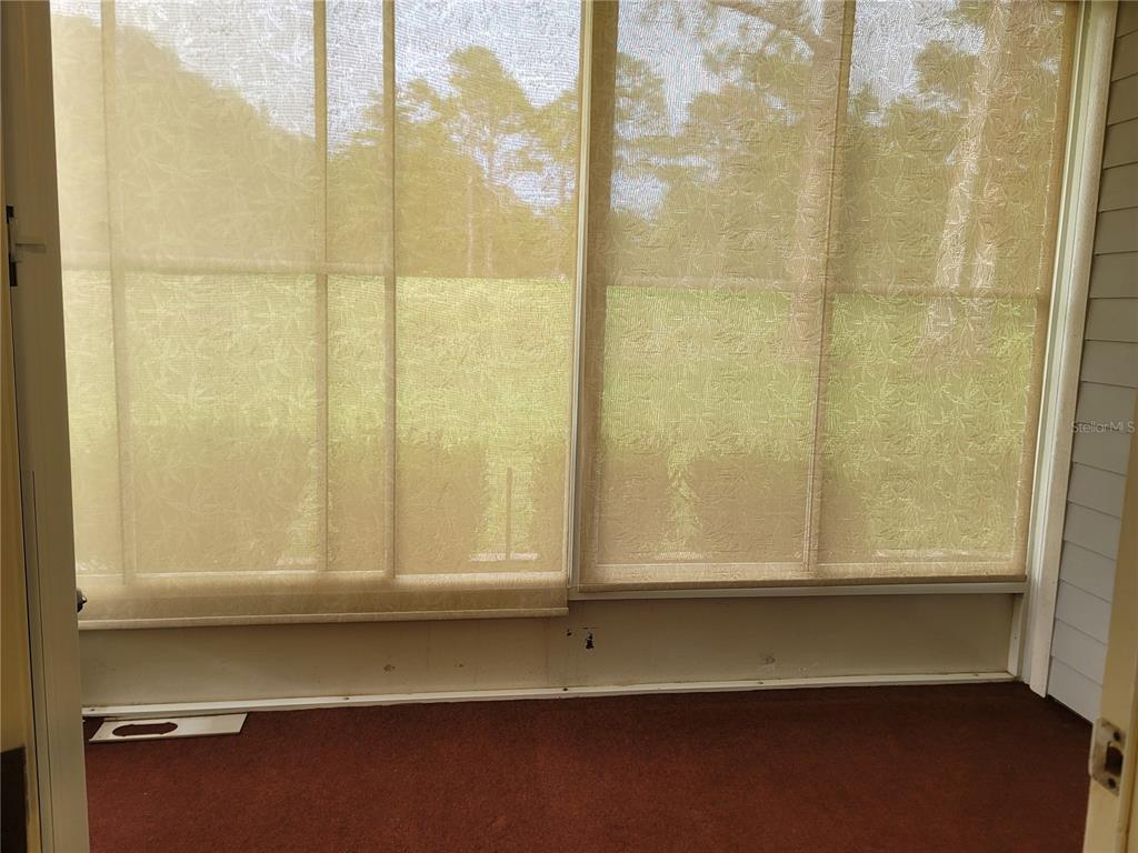 6312 Northwest 109th Place Alachua, FL 32615 - Photo 13 of 17 a view of wooden floor and a window