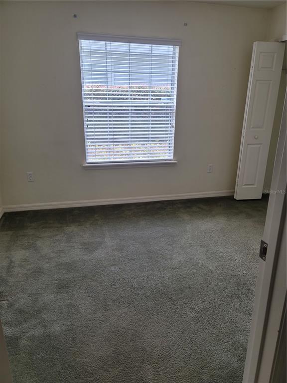 6312 Northwest 109th Place Alachua, FL 32615 - Photo 17 of 17 a view of an empty room with a window
