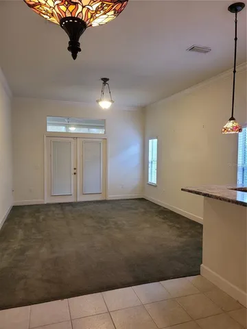 a view of an empty room and a window