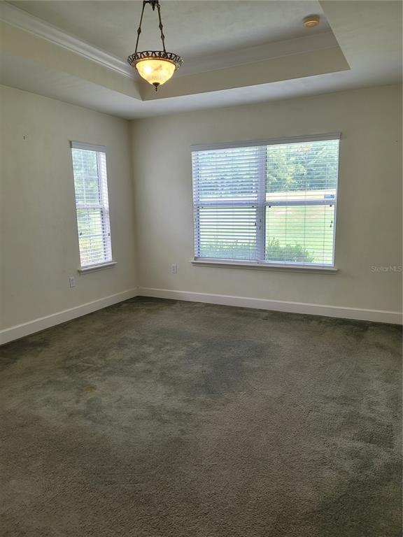 6312 Northwest 109th Place Alachua, FL 32615 - Photo 6 of 17 a view of an empty room with a window