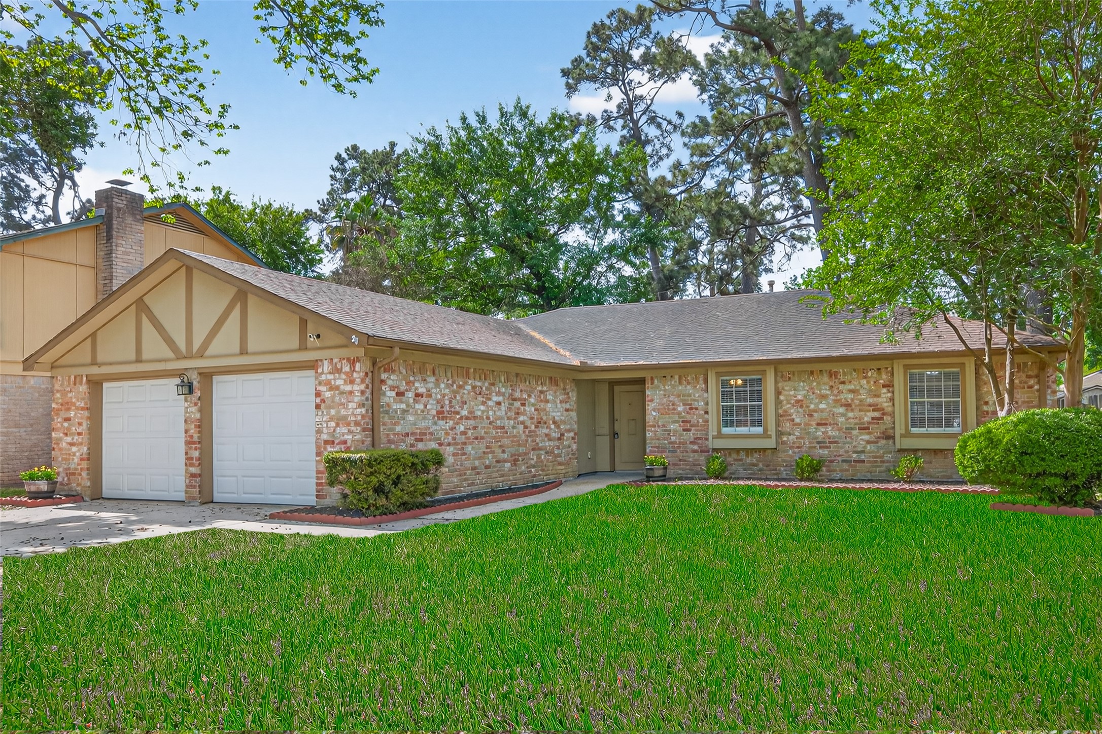 23919 Farm Hill Drive Spring, TX 77373 - Photo 4 of 41 a view of a house with a yard and a large tree