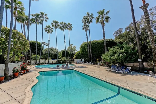 a view of a swimming pool with a table and chairs