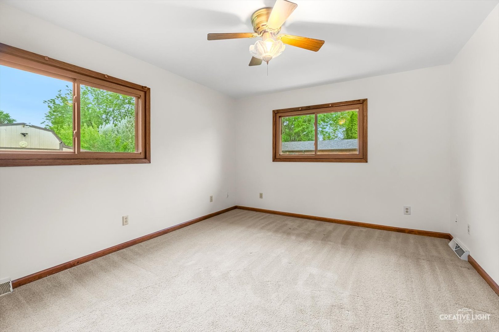 1483 Nova Road Sandwich, IL 60548 - Photo 16 of 29 an empty room with windows and fan