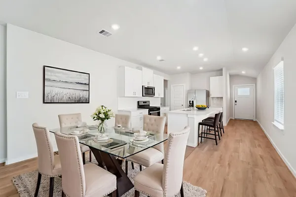a view of a dining room with furniture