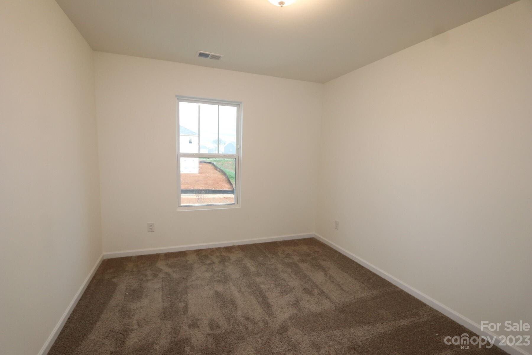 345 Willowsford Drive Monroe, NC 28110 - Photo 4 of 9 an empty room with a window
