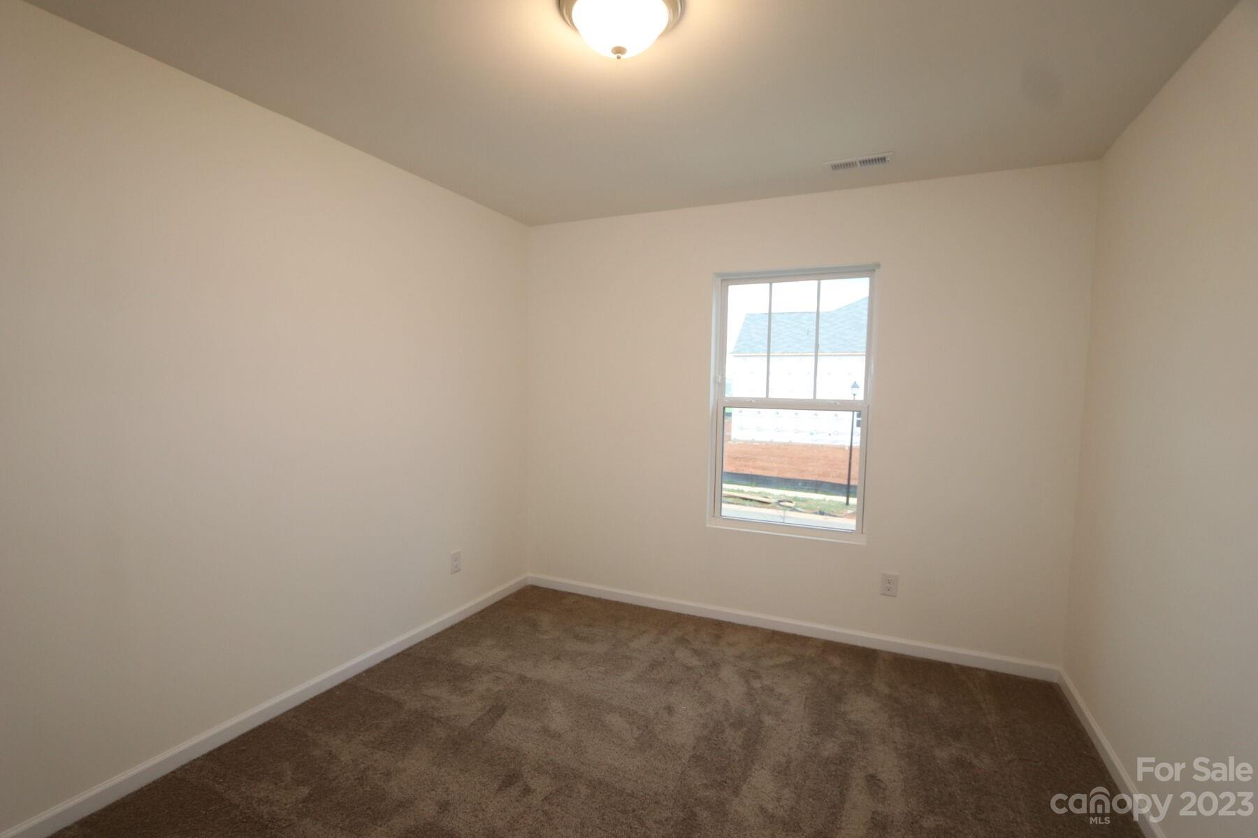 345 Willowsford Drive Monroe, NC 28110 - Photo 5 of 9 an empty room with a window