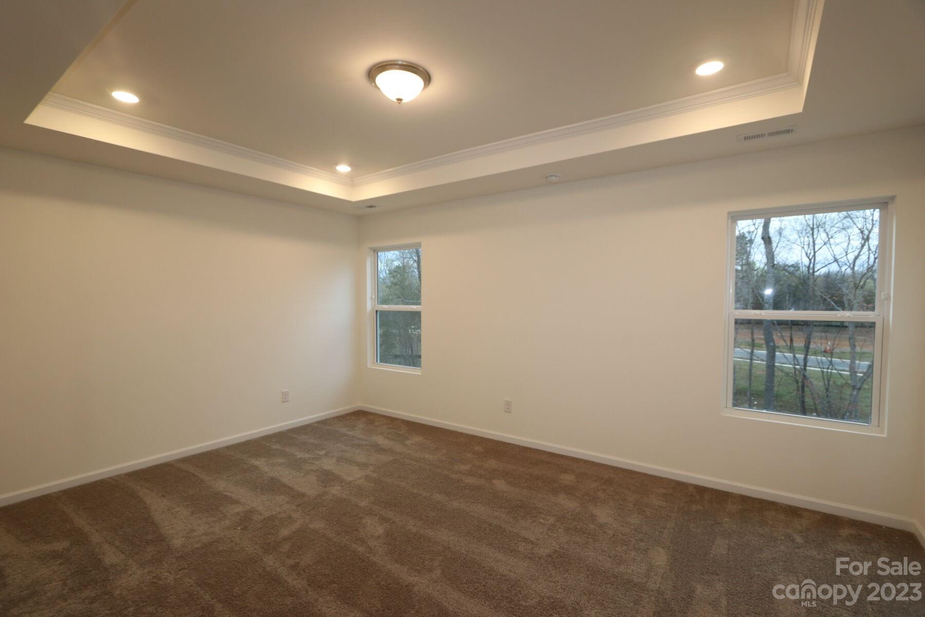 345 Willowsford Drive Monroe, NC 28110 - Photo 6 of 9 an empty room with windows