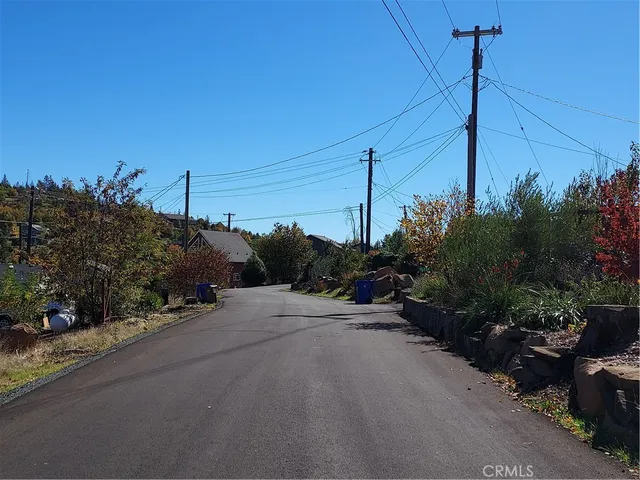 a view of a swimming pool with a yard