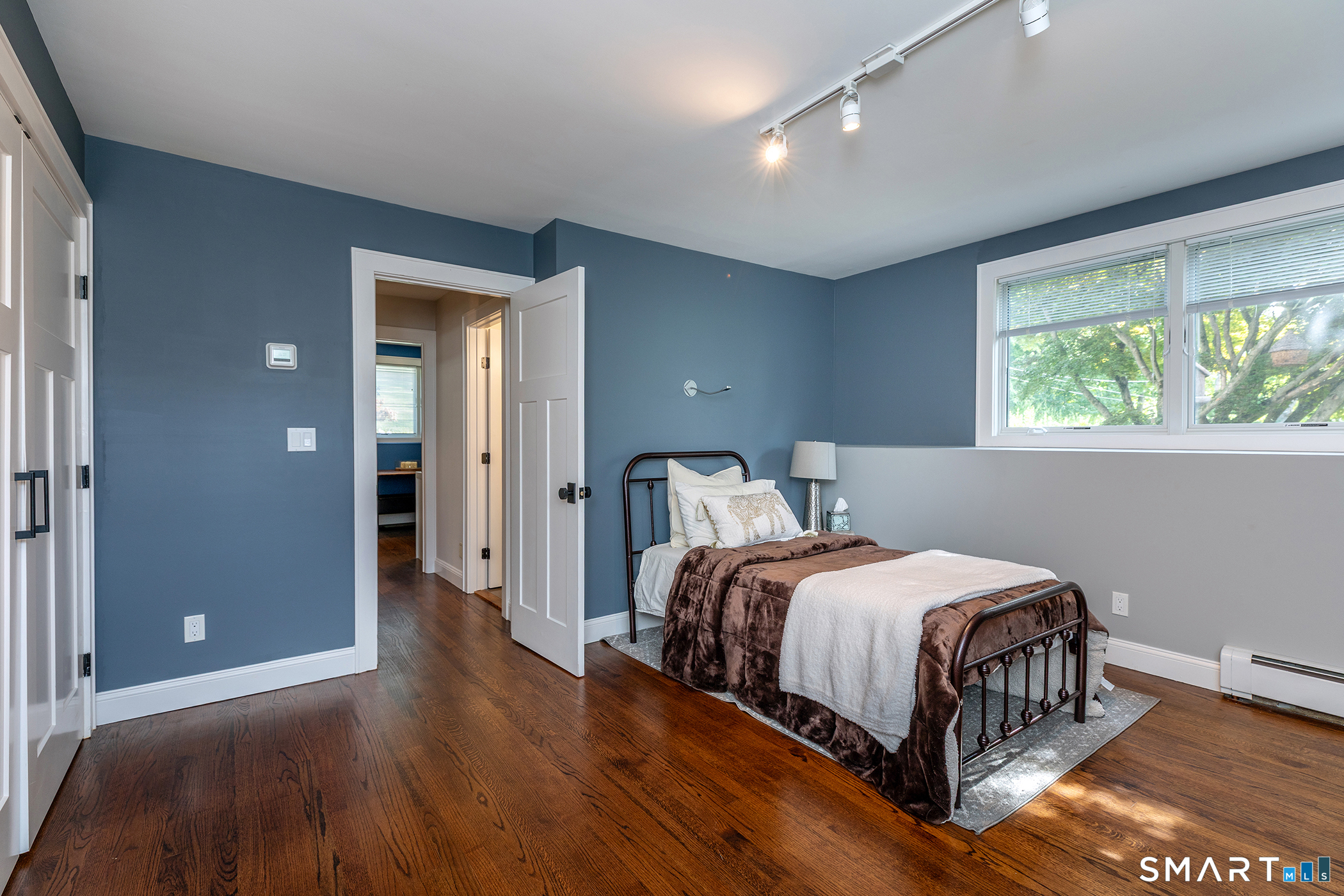 145 Pine Hill Road New Fairfield, CT 06812 - Photo 11 of 35 a bedroom with a bed and window