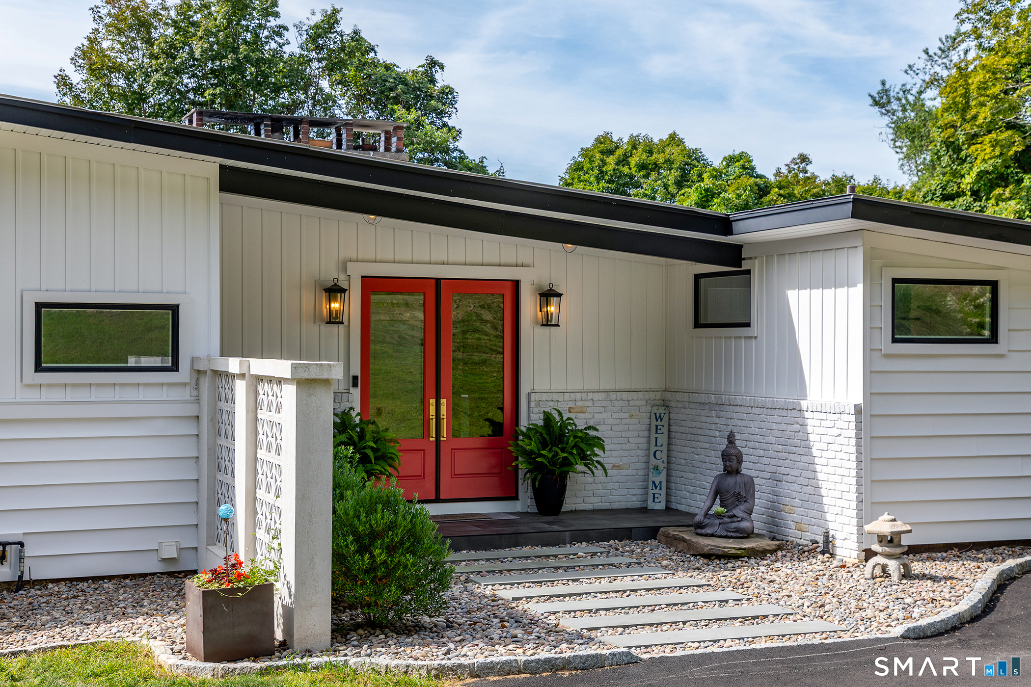 145 Pine Hill Road New Fairfield, CT 06812 - Photo 2 of 35 a front view of a house with a yard