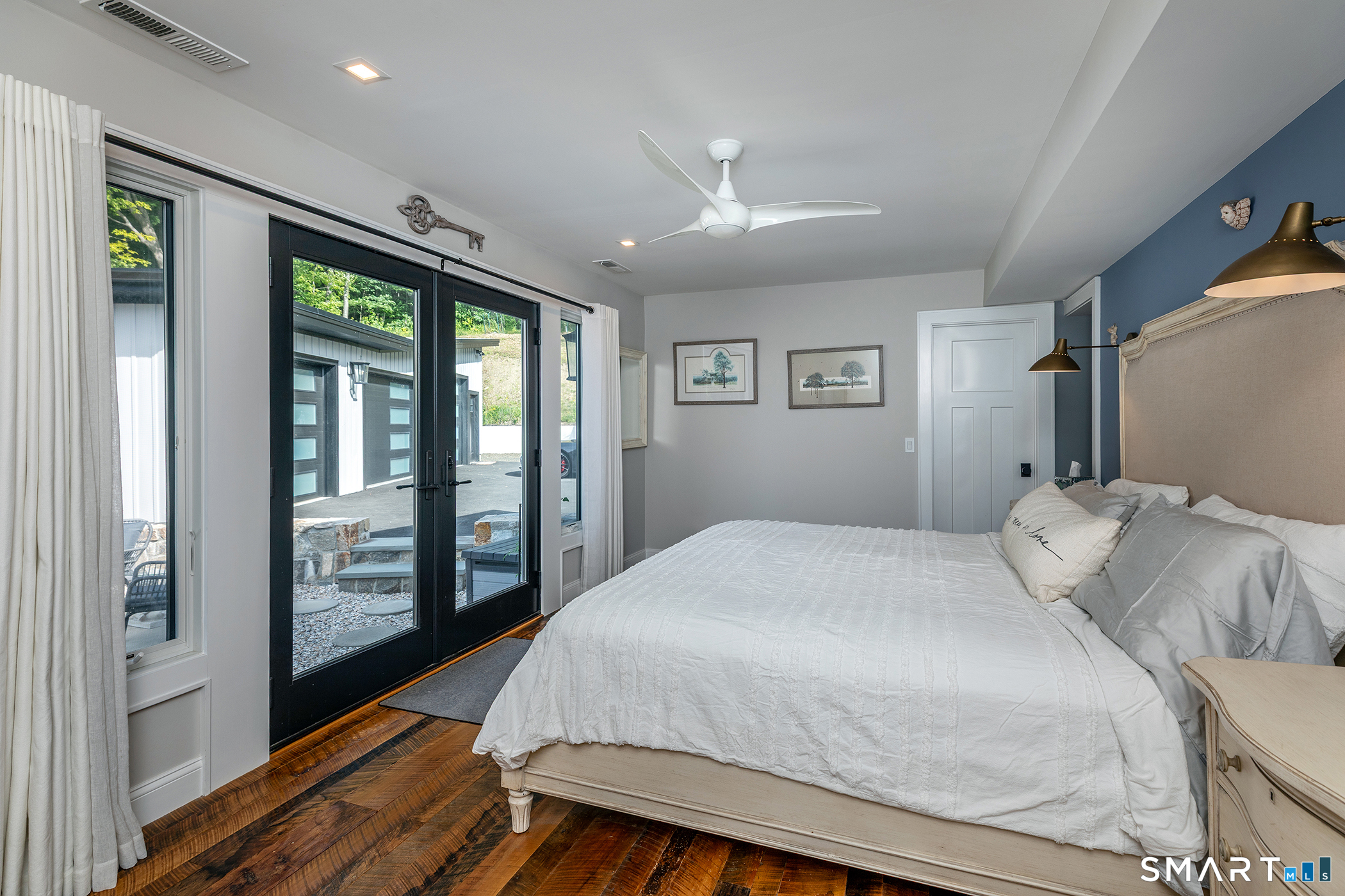 145 Pine Hill Road New Fairfield, CT 06812 - Photo 22 of 35 a bedroom with a large bed and a large window
