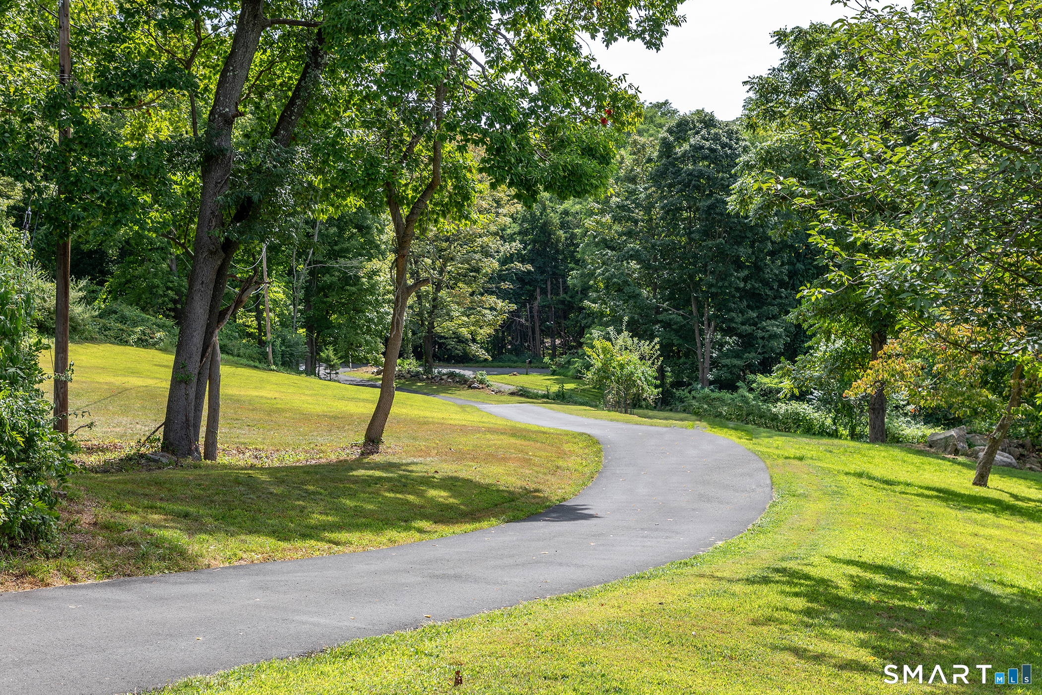 145 Pine Hill Road New Fairfield, CT 06812 - Photo 31 of 35 a view of a swimming pool with a sitting area