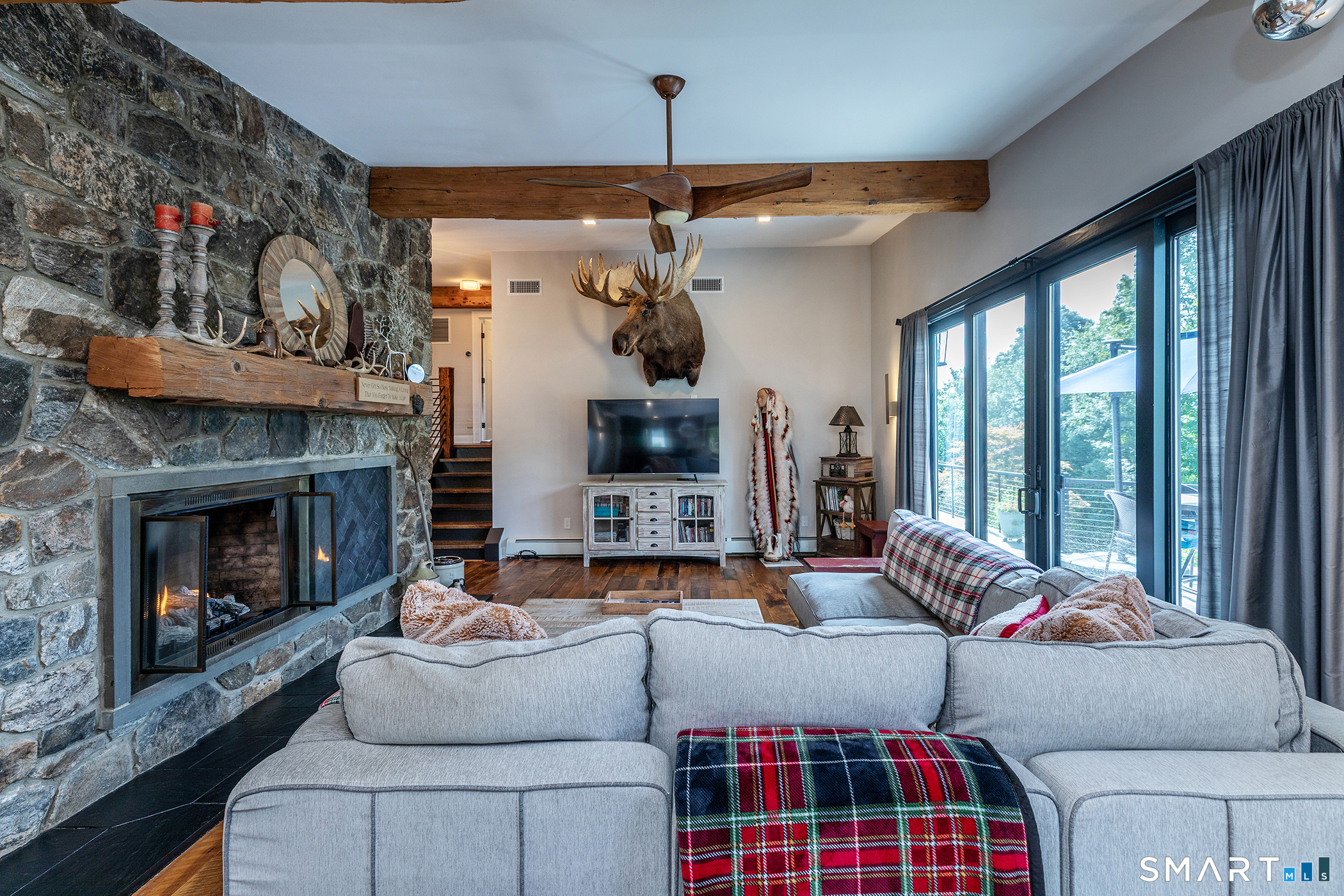 145 Pine Hill Road New Fairfield, CT 06812 - Photo 4 of 35 a living room with furniture a flat screen tv and a fireplace