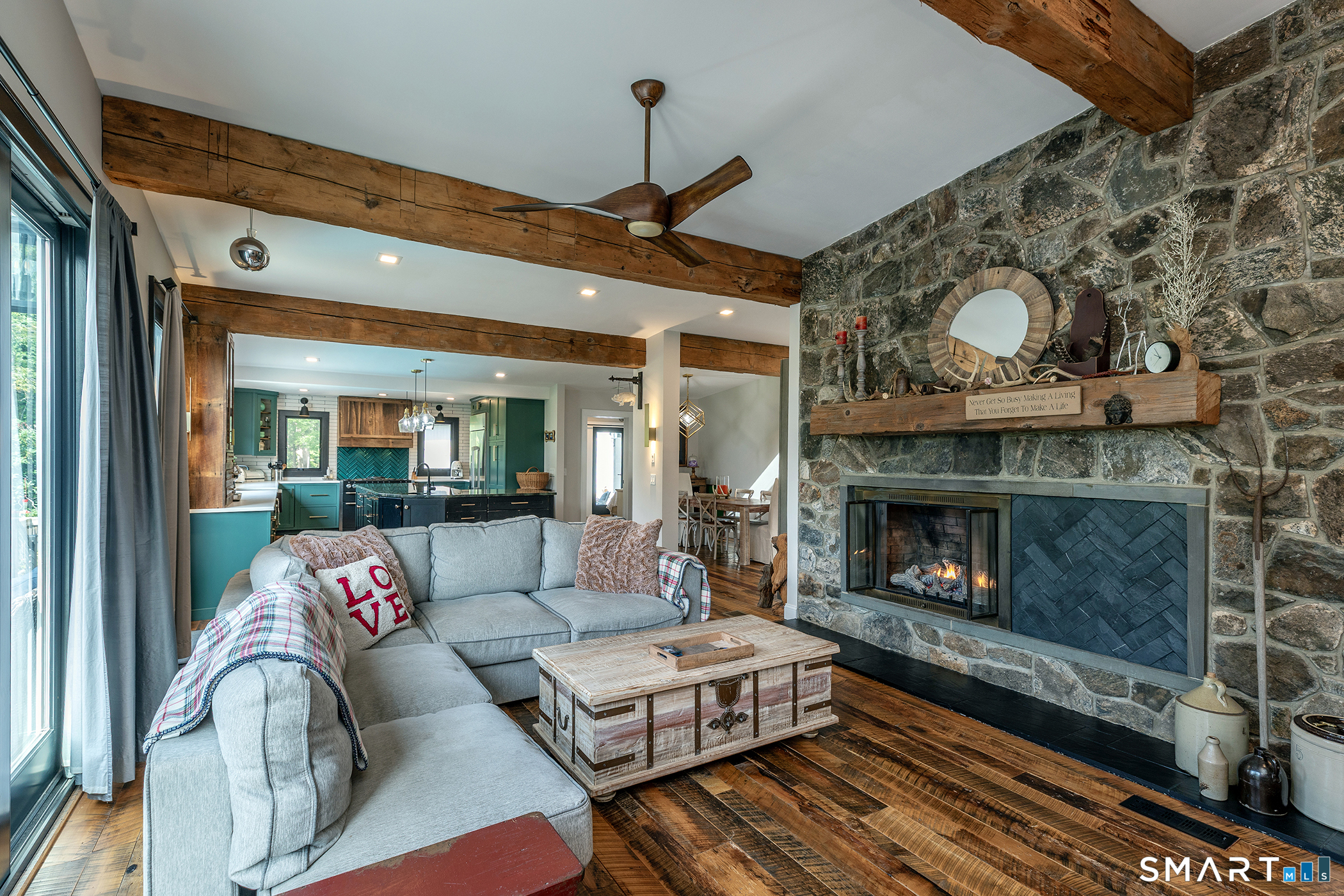 145 Pine Hill Road New Fairfield, CT 06812 - Photo 5 of 35 a living room with furniture and a fireplace