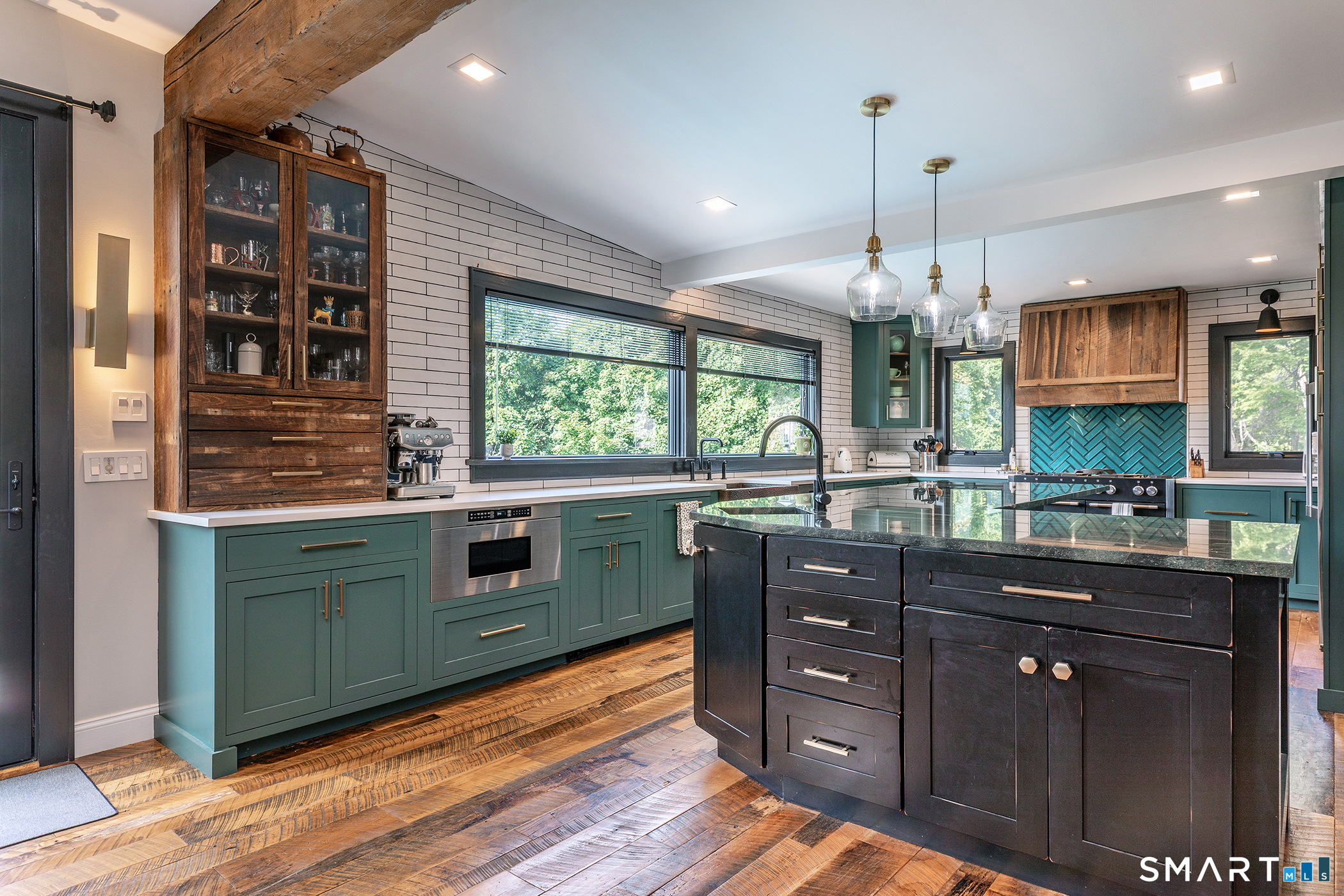 145 Pine Hill Road New Fairfield, CT 06812 - Photo 6 of 35 a kitchen with stainless steel appliances kitchen island granite countertop a stove and cabinets