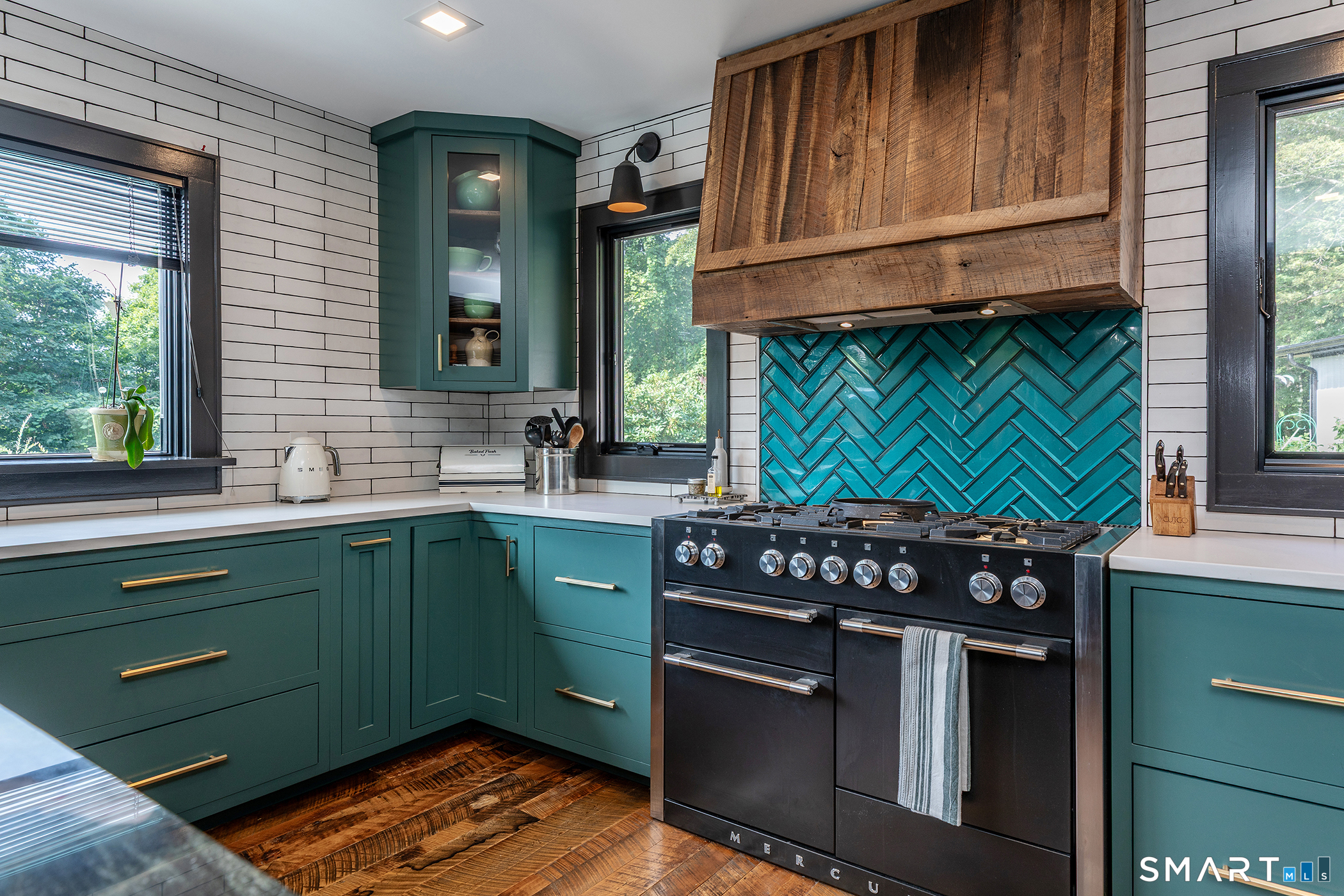 145 Pine Hill Road New Fairfield, CT 06812 - Photo 8 of 35 a kitchen with stainless steel appliances granite countertop a sink a stove and a wooden cabinets