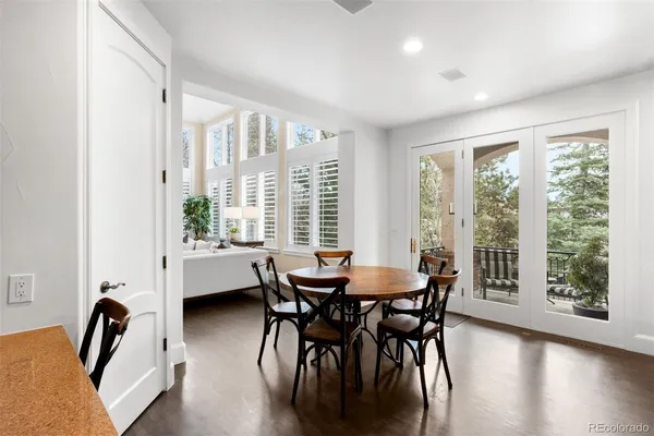 a kitchen with a sink a counter space appliances and cabinets
