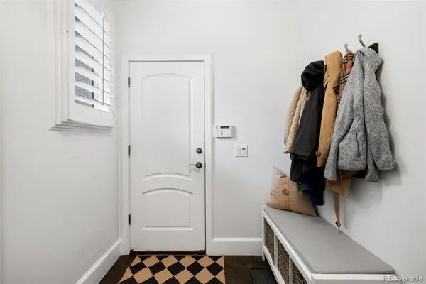 a bed room with furniture and a flat screen tv