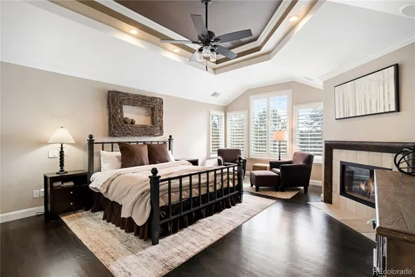 a bedroom with a bed and a fireplace