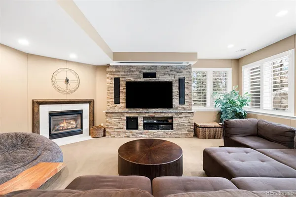 a living room with granite countertop furniture and a chandelier
