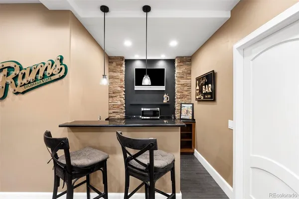 a large kitchen with a stove and a sink