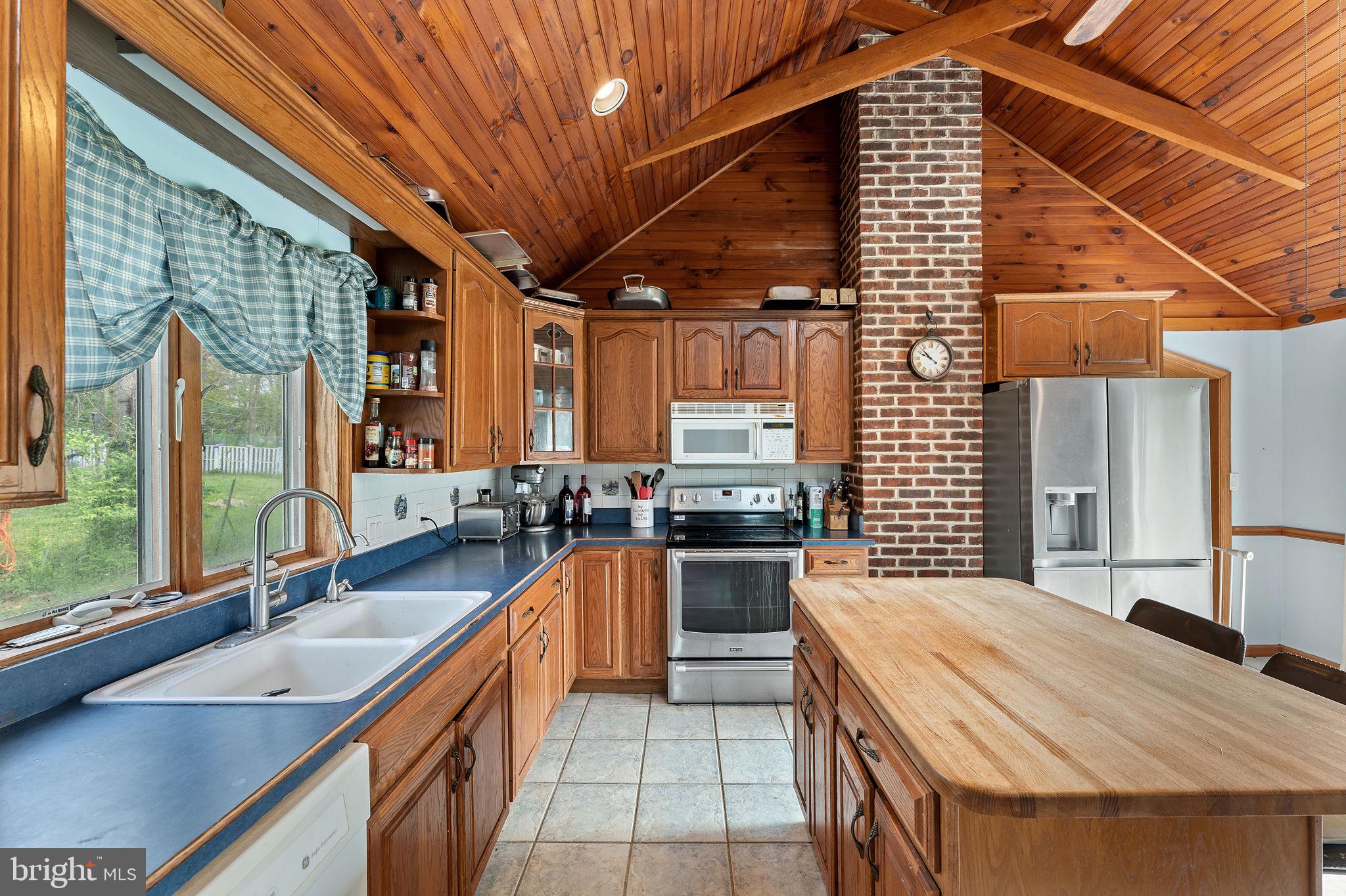 420 Russell Road Berryville, VA 22611 - Photo 22 of 60 Warm wood accents in a cozy kitchen.
