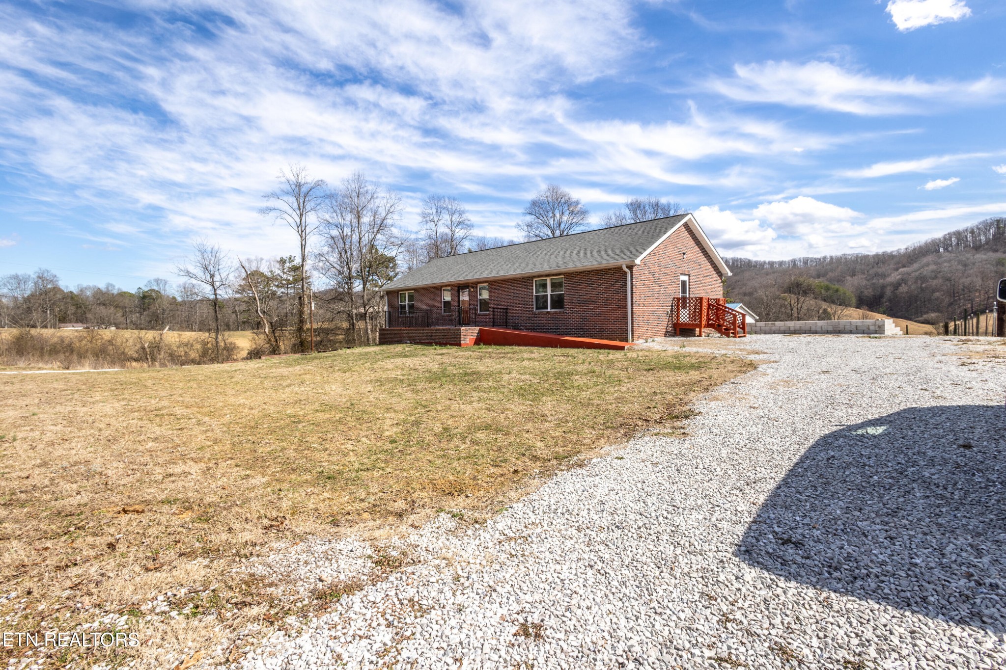 1208 Dutch Valley Road Clinton, TN 37716 - Photo 20 of 21 a view of a house with a yard and sitting area
