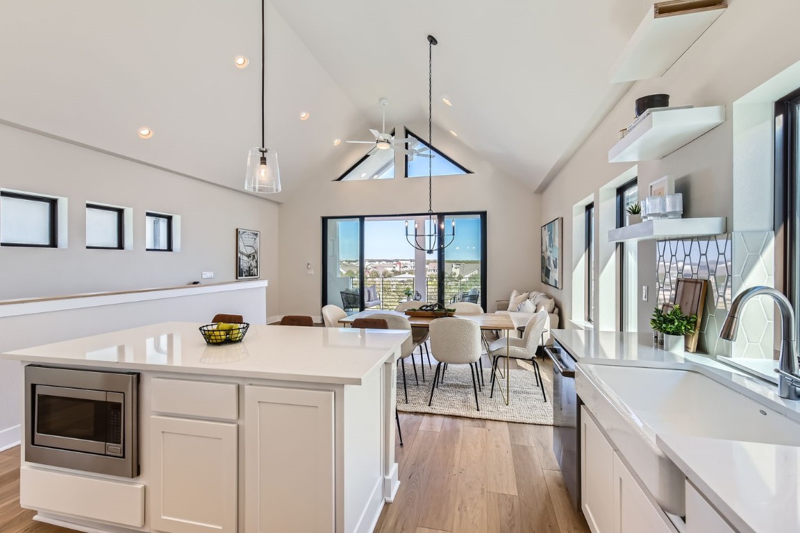 9101 Cattle Baron Path Austin, TX 78747 - Photo 20 of 29 a view of a kitchen area with furniture and wooden floor