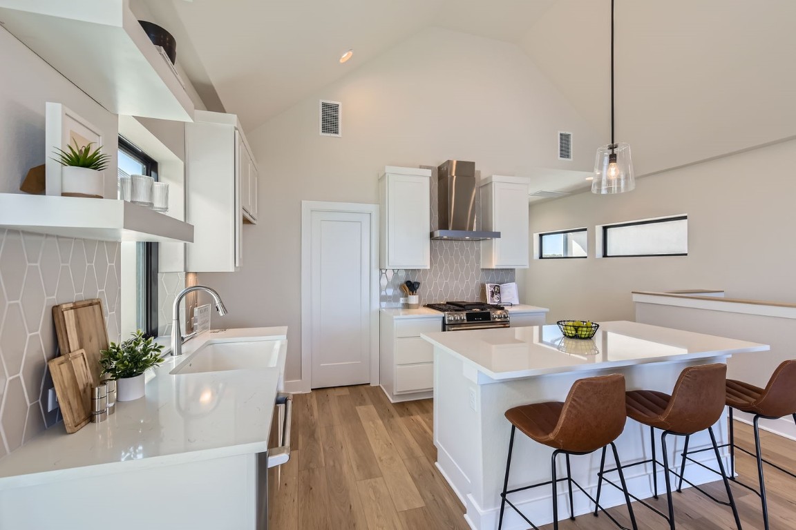 9101 Cattle Baron Path Austin, TX 78747 - Photo 21 of 29 a kitchen with a sink cabinets and window