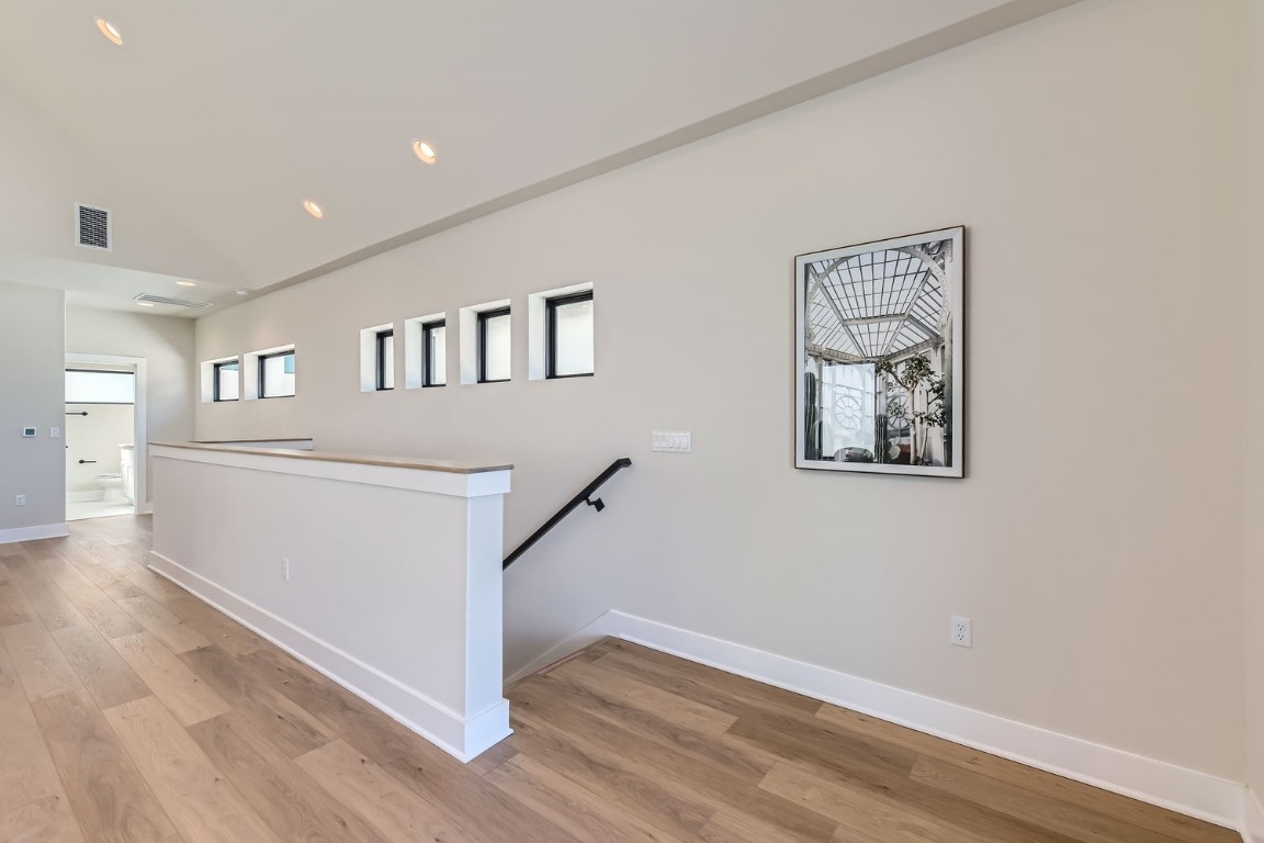 9101 Cattle Baron Path Austin, TX 78747 - Photo 23 of 29 a view of livingroom with hallway and wooden floor
