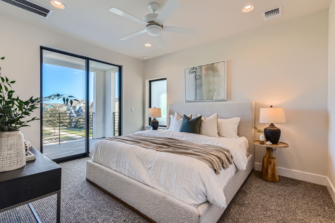 9101 Cattle Baron Path Austin, TX 78747 - Photo 7 of 29 a spacious bedroom with a bed and a window