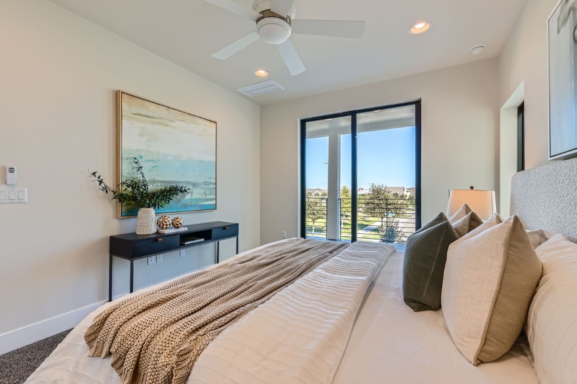 9101 Cattle Baron Path Austin, TX 78747 - Photo 8 of 29 a bedroom with a bed and a potted plant