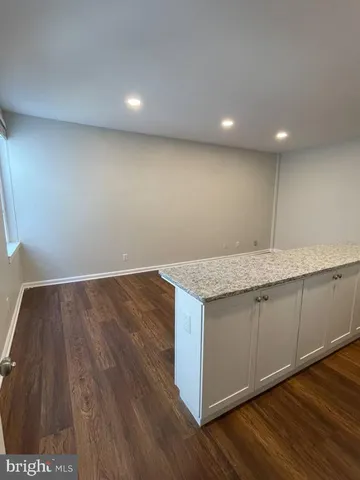 an empty room with wooden floor