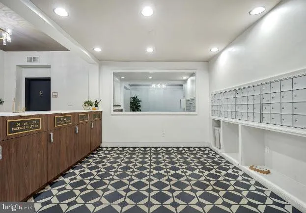 a large kitchen with a sink and cabinets