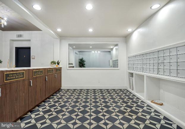 1669 Columbia Road Northwest, Unit 215 Washington, DC 20009 - Photo 3 of 25 a large kitchen with a sink and cabinets