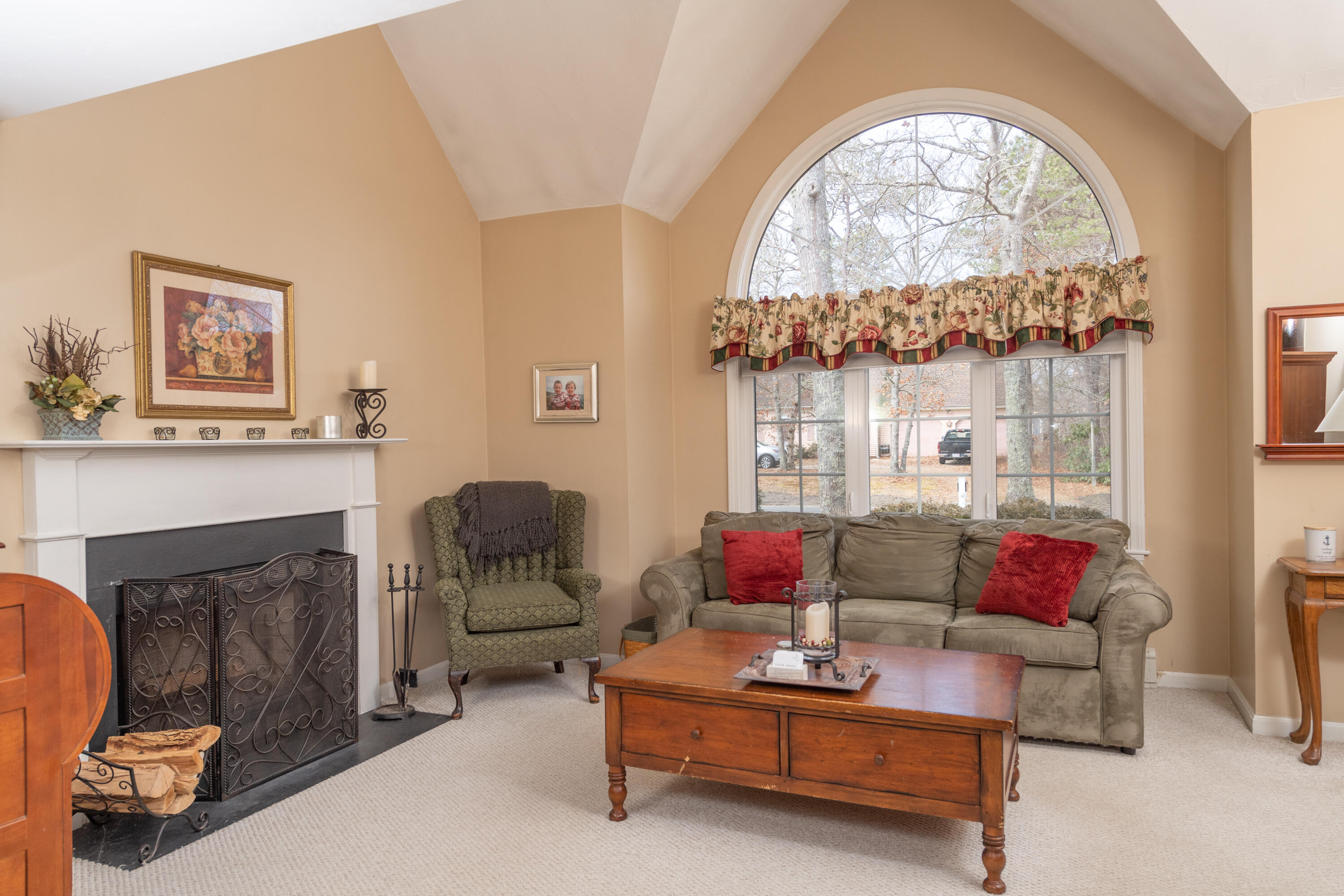 19 Carleton Drive Mashpee, MA 02649 - Photo 11 of 45 a living room with furniture and a fireplace