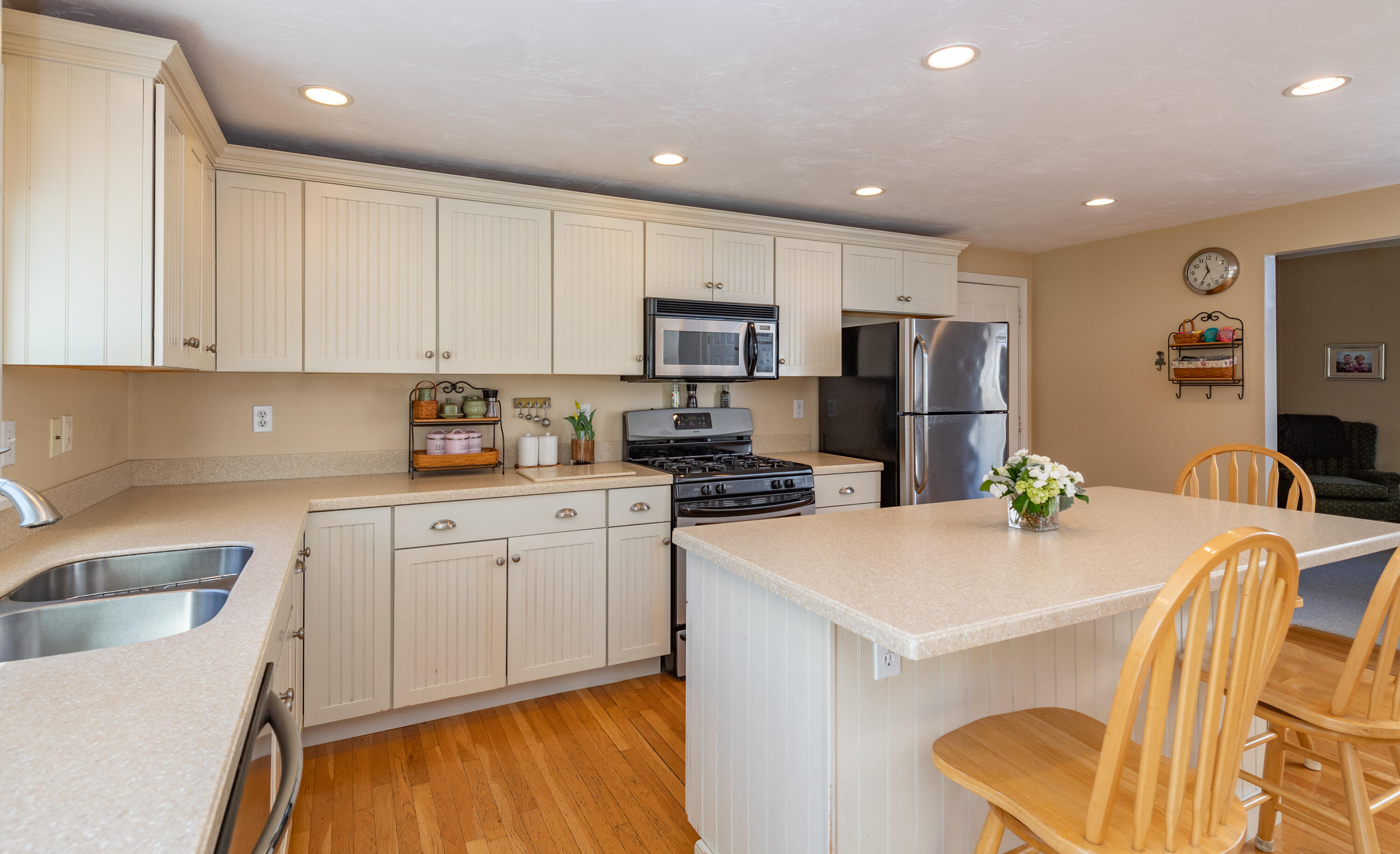 19 Carleton Drive Mashpee, MA 02649 - Photo 16 of 45 a kitchen with stainless steel appliances granite countertop a sink refrigerator and microwave