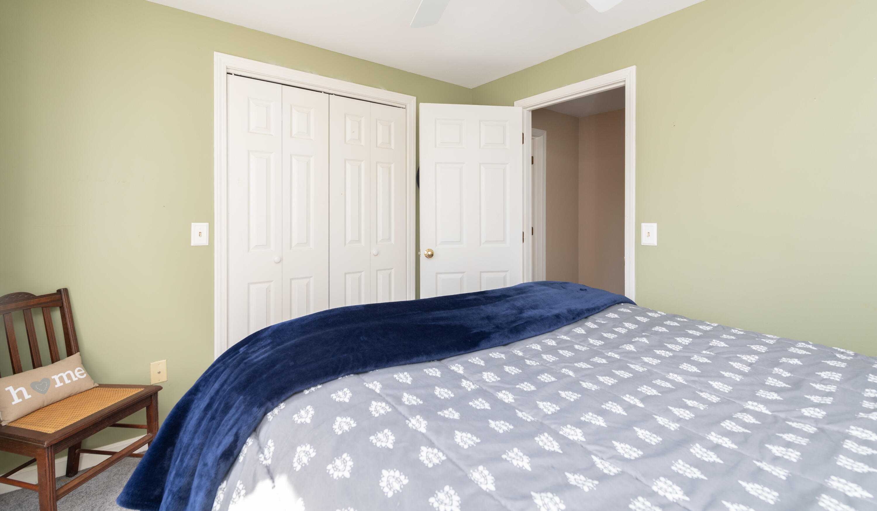 19 Carleton Drive Mashpee, MA 02649 - Photo 24 of 45 a bedroom with a bed and chair